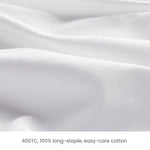 400-thread-count white cotton sateen fabric detail, used in Fix Linens sheets and duvet covers.
