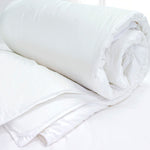 Cal King comforter lifestyle in white cotton, detail view for Airbnb hosts