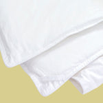 Twin/TwinXL hypoallergenic down-alternative comforter in white cotton, corner loop detail for Airbnb hosts