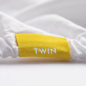 
                  
                    twin sheet set folded, flat sheet has no embroidery, fitted sheet has a small yellow tag with the word twin, 2 standard pillowcases no embroidery
                  
                