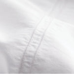 Queen flat sheet embroidery detail close-up showing size indicator stitching