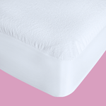Corner of mattress with queen size waterproof breathable mattress protector fitted securely, showing snug elastic edges.