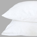 Two stacked king-size pillows with Fix Linens white waterproof breathable pillow protectors showing smooth, fitted design.