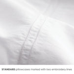 Standard pillowcase sheet detail close-up showing size indicator embroidery