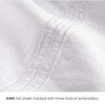 King white cotton flat sheet with embroidery lines indicating size, ideal for Airbnb hosts