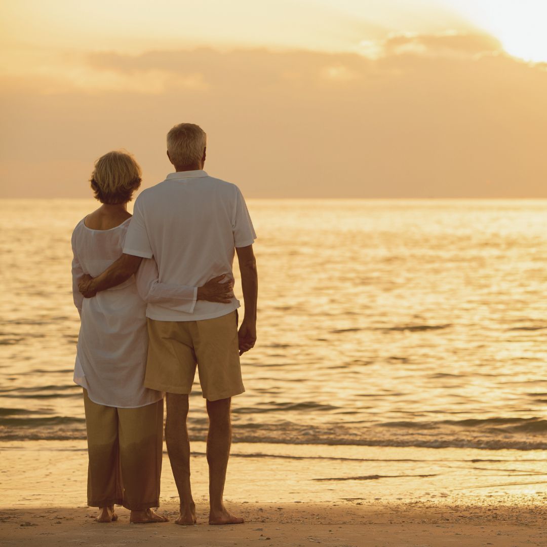 image of older couple on the beach