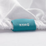 King fitted sheet with a blue color coded tag marking the top center