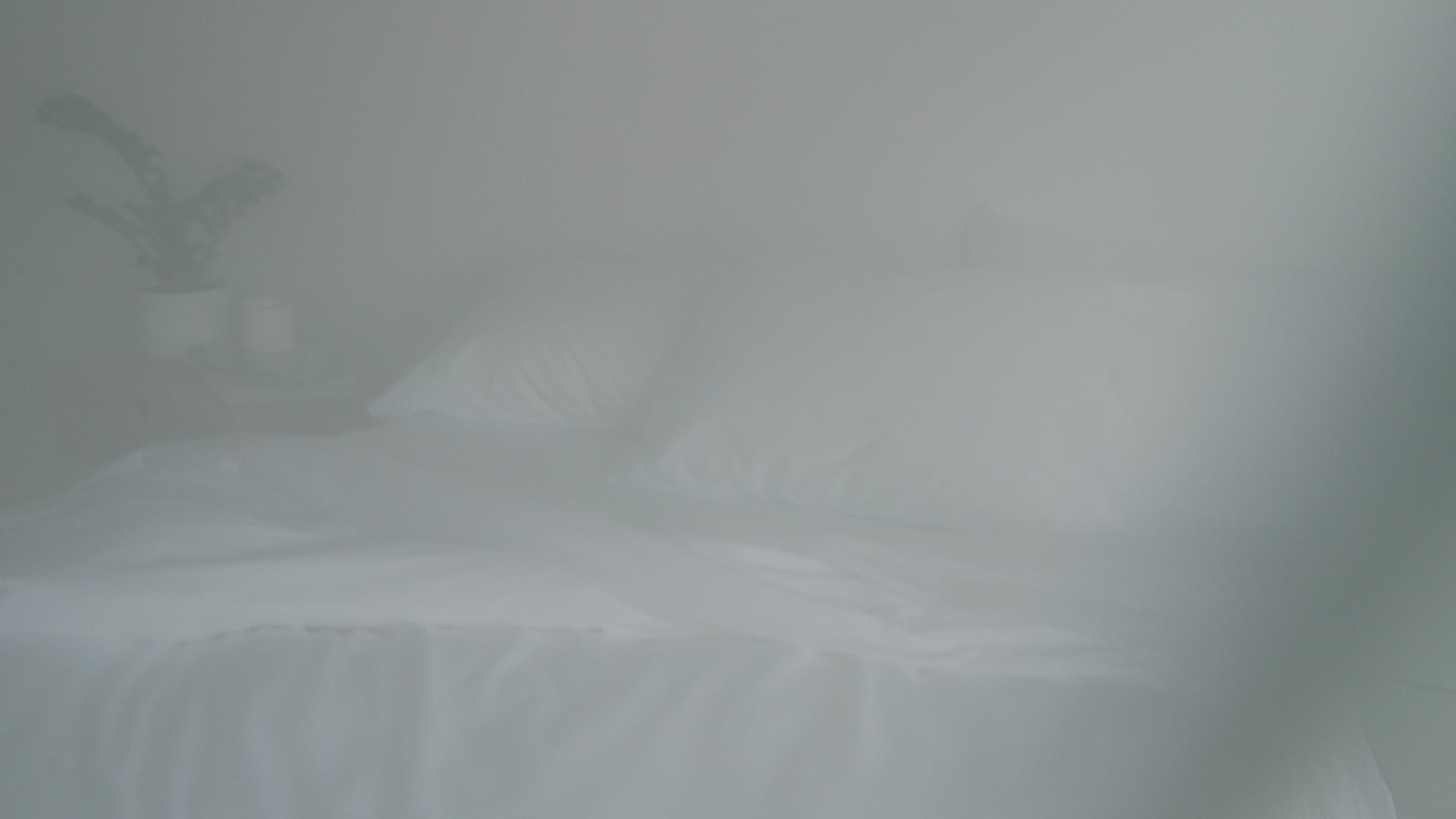 a woman is changing a triple-zip duvet cover