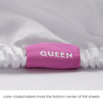 queen fitted sheet with color coded tag marking the top center